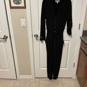Michael Kors black knit jumpsuit.  Drawstring waist.  Pockets.  Snaps.  EUC